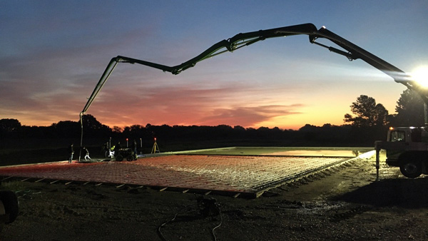 concrete foundation being worked on at sunset