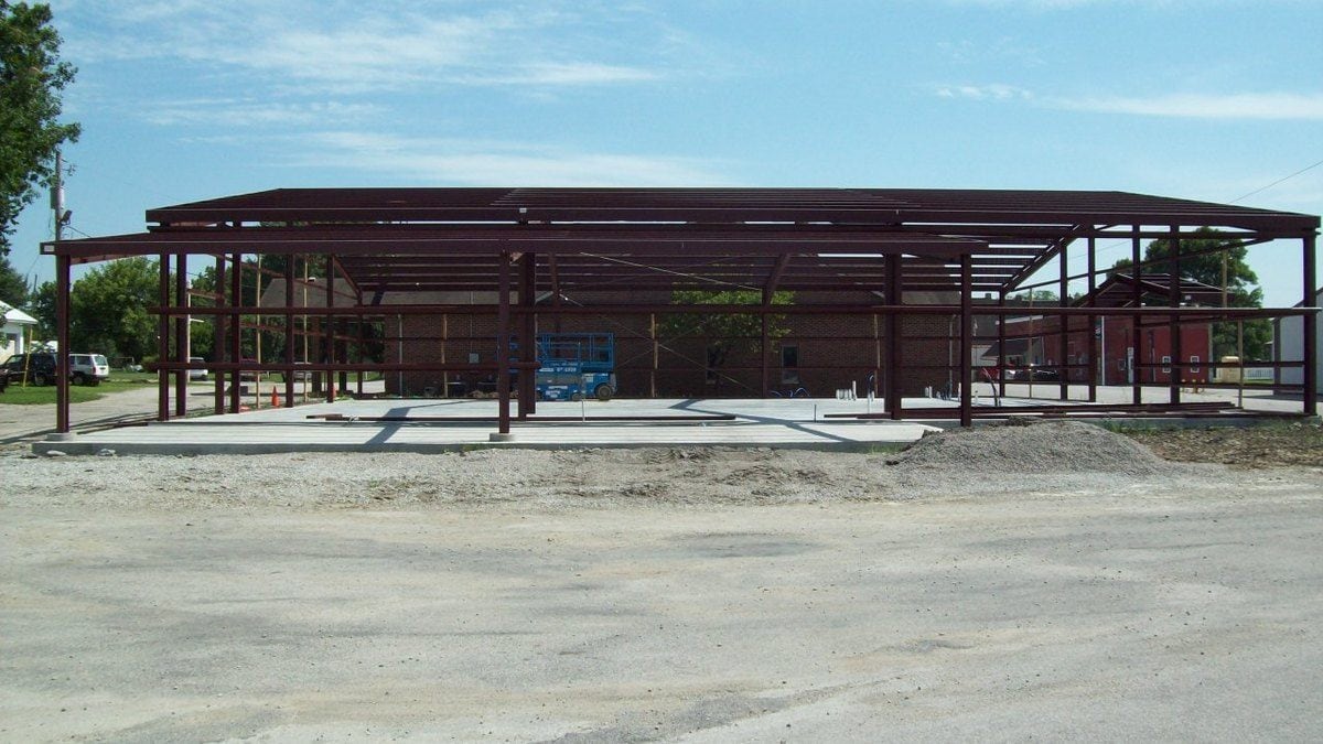 metal building contractors erecting a library