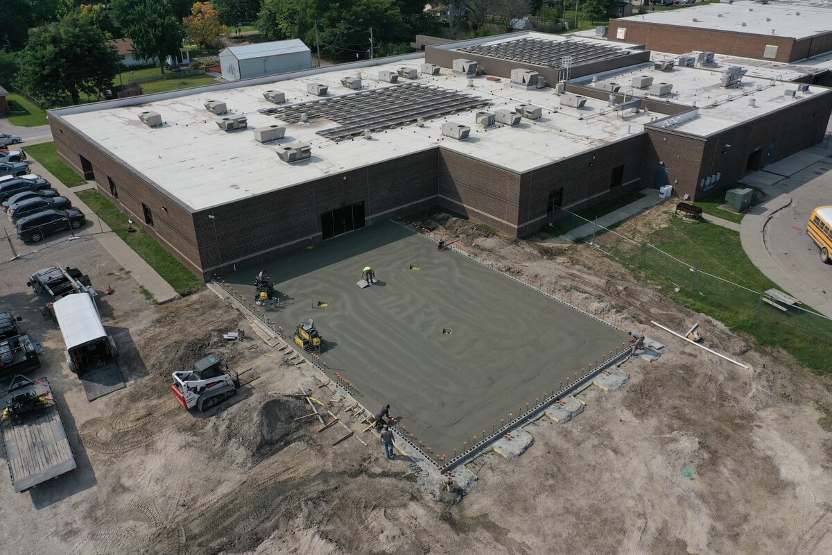 concrete being poured for school