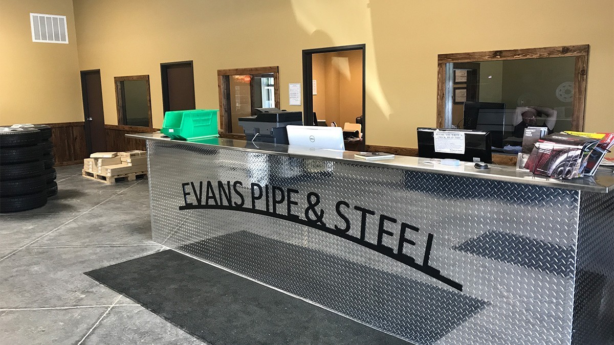 evans pipe and steel building sign