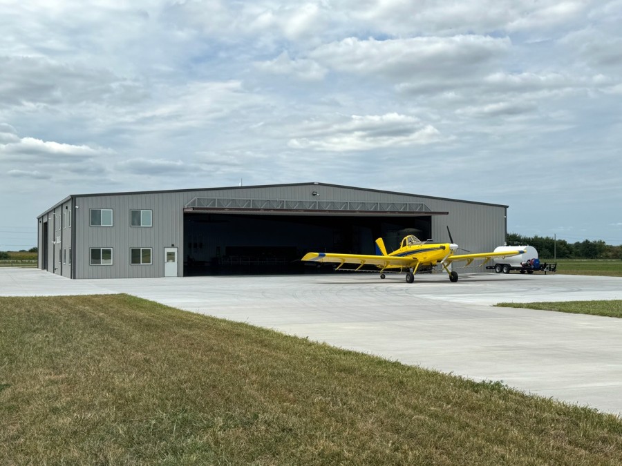 prop plane exiting hangar's large hydraulic door prop plane exiting hangar's large hydraulic door