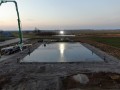 aerial view of concrete pour for large agricultural buliding