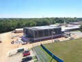 aerial view of metal gymnasium being constructed