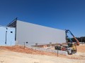 exterior of steel gymnasium building being installed