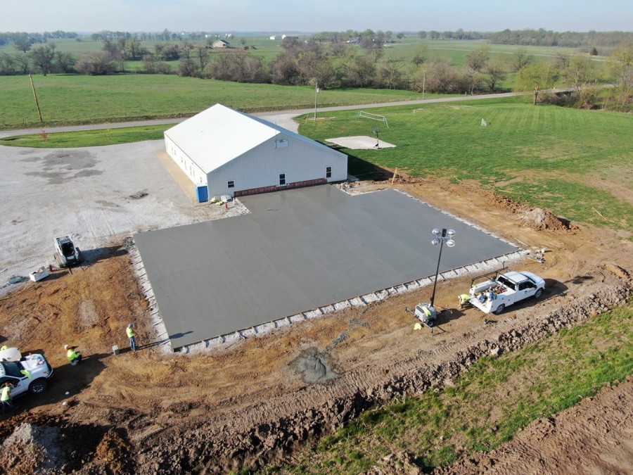 concrete foundation being poured for school