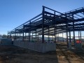 pre-engineered metal building frame being installed
