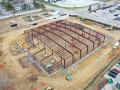 aerial view of pre-engineered metal building being erected