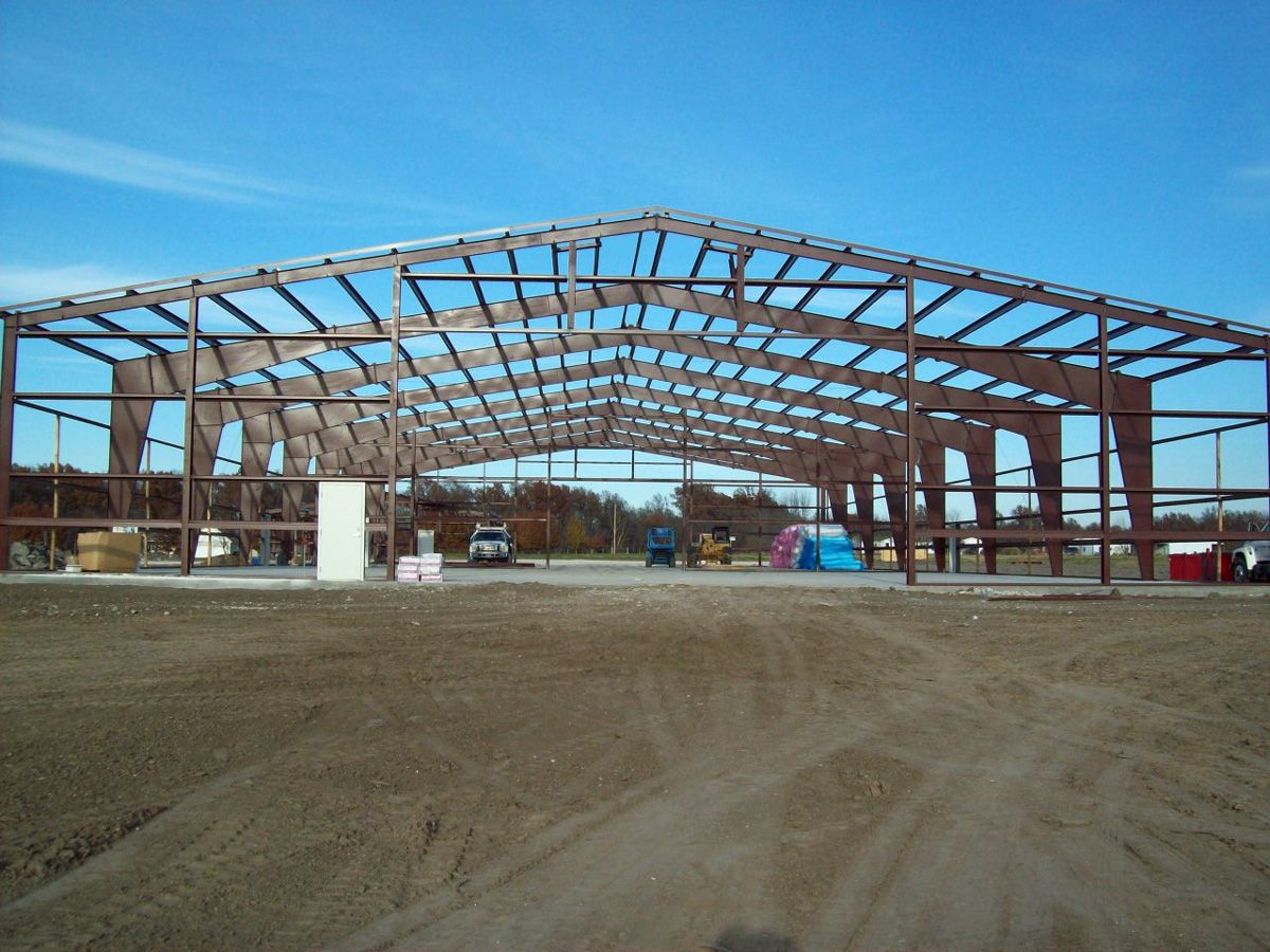 contractors erecting pre-engineered metal warehouse building